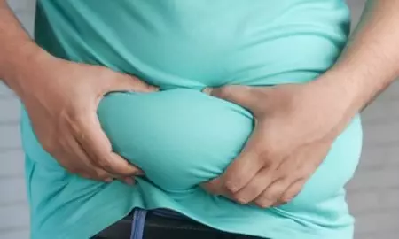 a man holding his stomach with his hands